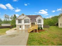 Charming two-story home with landscaped yard and inviting front porch at 7240 Raintree Loop, Jonesboro, GA 30236