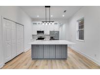 Bright kitchen features a large island, stainless steel appliances, and plenty of storage at 926 Welch Sw St, Atlanta, GA 30310