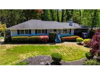 Charming single-story home with a well-maintained lawn and colorful landscaping at 4519 Sims Ct, Tucker, GA 30084