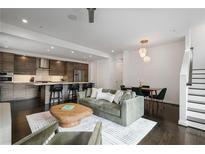 Open-concept living room showcases a modern kitchen and dining area in a well-lit space at 504 Rankin Ne St # 4, Atlanta, GA 30308