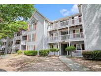 Charming condo building with well-maintained landscaping and exterior features at 233 Cobblestone Trl, Avondale Estates, GA 30002