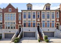 Charming brick townhomes with stone accents and individual garages at 1276 Edmund Ne Ln, Brookhaven, GA 30319