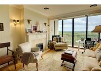 Bright living room features fireplace, large windows, and comfortable seating at 145 15Th Ne St # 1015, Atlanta, GA 30309