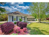 Charming single-story home with manicured lawn, lovely landscaping, and welcoming curb appeal at 72 Grayson New Hope Rd, Grayson, GA 30017