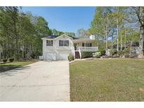 Charming split-level home with two-car garage, front porch, and landscaped yard at 278 Benjamin Dr, Rockmart, GA 30153