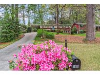 Charming home featuring a well-manicured lawn and inviting curb appeal at 1998 Jordan Terrace Ne, Atlanta, GA 30345