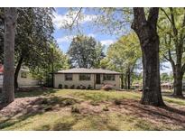 Charming single-story home featuring a well-maintained lawn and mature trees at 1089 Greenleaf Se Rd, Atlanta, GA 30316
