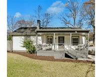 Charming single-story home with a welcoming front porch, landscaped yard, and classic architectural details at 777 Forrest Nw St, Atlanta, GA 30318