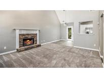 Bright living room featuring a stone fireplace and high vaulted ceilings at 432 Tanner Farm Dr, Rockmart, GA 30153