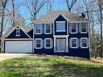 Charming two-story home with a two-car garage and symmetrical window design at 2570 Treasure Ct, Decatur, GA 30034