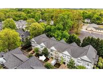 An aerial view of a townhome community surrounded by mature trees and landscaping at 951 Glenwood Se Ave # 1805, Atlanta, GA 30316