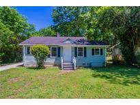 Charming single-story home with a well-maintained front yard and traditional architecture at 4684 City View Dr, Forest Park, GA 30297