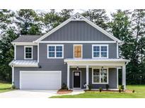 Charming two-story home with gray siding, white trim, and a welcoming front porch at 2626 Radvell Ct, Decatur, GA 30034