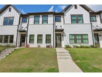Beautiful townhome featuring a modern exterior, lovely landscaping, and inviting entryway at 2424 Lakeshore Se Ln, Atlanta, GA 30316