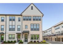 Charming new construction townhome with a brick facade and inviting curb appeal at 4068 Allegretto Se Cir # 10, Atlanta, GA 30339