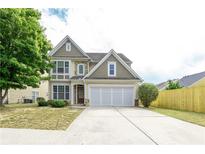 Charming two-story home with a three-car garage and well-manicured front yard at 2656 Staunton Ln, Duluth, GA 30096