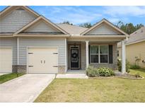 Charming single-Gathering home featuring a well-manicured lawn and an attached garage at 515 Vandenburg Dr, Villa Rica, GA 30180