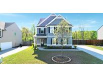 Charming two-story home with stone accents, manicured lawn, and classic architectural details at 269 Shoals Bridge Rd, Acworth, GA 30102