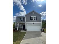 Charming two-story home with a well-maintained lawn and attached two-car garage at 87 Sonoma Drive, Dallas, GA 30157