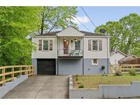 Charming home featuring a quaint front porch and a well-maintained yard at 298 Birch St, Atlanta, GA 30354