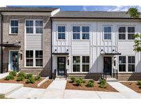 Charming new townhomes with attractive exteriors, sidewalks, and manicured landscaping at 359 Skylar Se Ct, Atlanta, GA 30315