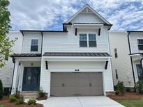 Charming two-story home with a welcoming front facade and a two-car garage at 685 Summitt Hill Way, Cumming, GA 30040