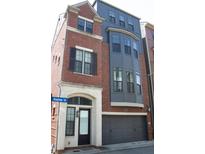 Beautiful townhome with brick and modern siding, attached two-car garage and arched entry at 600 Broadview Ne Ter, Atlanta, GA 30324