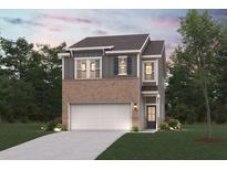 Charming two-story home with a brick and gray siding exterior and well-manicured front yard, offering great curb appeal at 1030 Sutherland Lane (Lot 46), Lawrenceville, GA 30043