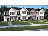 Charming new construction townhomes featuring manicured lawns and inviting entryways at 4277 Arcadia Dr, Decatur, GA 30034
