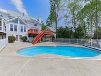 Inviting backyard pool and deck are perfect for entertaining and enjoying the outdoors at 140 N Lakeside Nw Dr, Kennesaw, GA 30144
