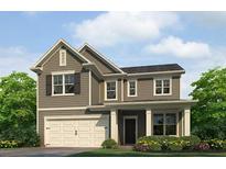 Charming two-story home with a craftsman-style design, attached garage, and well-manicured landscaping at 4520 Ajo Lot#6 Walk, Atlanta, GA 30331