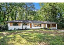 Charming renovated single-story home with modern updates, landscaping, and a welcoming front yard at 2685 Glenvalley Dr, Decatur, GA 30032