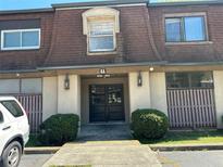 Apartment building entrance featuring double doors, building number and exterior lighting at 3038 Parc Lorraine, Lithonia, GA 30038
