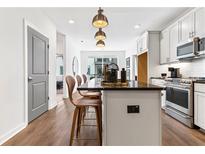 Modern kitchen featuring a large island with seating and stainless steel appliances at 388 Pratt Se Dr # 2123, Atlanta, GA 30315
