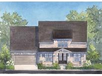Charming two-story home featuring a stone facade, covered entry, and attached garage at 5235 Memento Trace, Cumming, GA 30040
