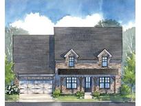 Charming two-story home with brick facade, covered porch, and attached two-car garage at 5345 Keepsake Court, Cumming, GA 30040