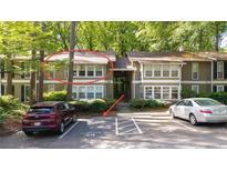 Attractive two-story townhome with reserved parking and a landscaped yard at 5141 Roswell Rd # 7, Atlanta, GA 30342