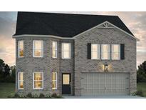 Beautiful two-story brick home with a dark roof and a two-car garage in a suburban neighborhood at 679 Egrets Landing Lot 57, Covington, GA 30014