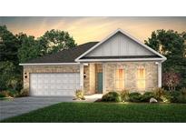 Charming single-story brick home with a two-car garage and manicured lawn at 2108 Amaryllis Dr, Grayson, GA 30017