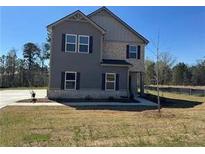 Charming two-story home featuring a combination of siding and brick, set on a spacious lot at 184 Weldon Rd, Mcdonough, GA 30253
