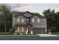 Charming two-story home featuring stone accents, gray siding, manicured landscaping, and an attached two-car garage at 7630 Homer Dr, Cumming, GA 30028
