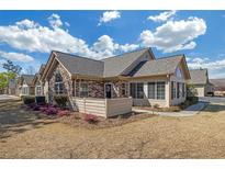 Charming single-story home with stone accents, manicured landscaping, and a welcoming entrance at 402 Silver Summit Se Dr, Conyers, GA 30094