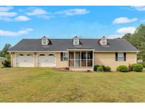 Charming home featuring a large front yard and a convenient two-car garage at 40 L Z Jackson Road, Bowdon, GA 30108