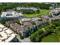Stunning aerial view of the apartments, lush greenery, golf course and surrounding neighborhood at 400 17Th Nw St # 2125, Atlanta, GA 30363