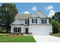 Charming two-story home with a manicured lawn, attached garage, and classic design at 233 Bloomfield Cir, Canton, GA 30114