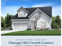 Beautiful French Country home with stone accents, lush landscaping, and a three-car garage at 267 Mooney Rd, Woodstock, GA 30188