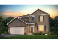Charming two-story home featuring a blend of brick and siding, a two-car garage, and a welcoming front entrance at 8509 Polston Place Lot 139, Douglasville, GA 30134