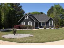 Charming one-story home with a well-manicured lawn and mature trees, offering a serene and inviting curb appeal at 545 Chaseridge Dr, Mcdonough, GA 30253
