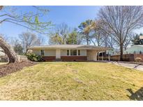 Charming single-story home with a well-maintained front yard and attached carport at 43 Lott Se Ave, Marietta, GA 30067