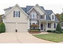 Charming two-story home with a two-car garage, stone accents, manicured lawn and inviting front porch at 278 Vine Creek Dr, Acworth, GA 30101